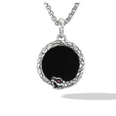 The Cairo Ouroboros Amulet is crafted with Sterling Silver and adorned with Black Onyx and Ruby gemstones. The black hue of the Onyx and the fiery red of the Ruby create a striking contrast, making this piece a captivating addition to the Cairo collection. Black Round Engraved Jewelry, Luxury Black Jewelry With Oxidized Finish, Engraved Round Onyx Jewelry, Black Jewelry With Oxidized Finish Round Pendant, Luxury Black Oxidized Jewelry, Black Amulet Style Pendant, Black Oxidized Finish Round Pendant Jewelry, Black Amulet Jewelry With Oxidized Finish, Black Amulet Necklace With Natural Stones