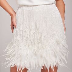 The Sara White Skirt, Is Worn To Make An Impact, Individually Hand Embellished With Crystal Waterfall Beading And Feather Tips. This Stunning Skirt Will Accentuate Your Curves And Flatter Your Figure. - Hand Embellished - Flat Sequin And Beaded Base - Feather Tipped Skirt Nadine Merabi, Embellished Flats, Skirt Medium, Make An Impact, White Skirt, White Skirts, Beading, Sequin, Womens Skirt