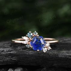 "This is a natural Lapis Lazuli engagement ring in solid gold,about 6x6mm Hexagon. The accent stones are moissanites and alexandrites. The band width is about 1.4mm. It can be made in any ring size. However please contact me to custom make it to a special big or small size. It can be made in white gold,rose gold or yellow gold with 14k or 18k. However for some people who are nickel allergic,I can also make it to 925 sterling silver to make you can wear it. The ring is handmade,very high quality! Lapis Ring Engagement, Cluster Engagement Ring Silver, Lapus Lazuli Engagement Ring, Lapis Wedding Ring, Lapis Lazuli Ring Gold, Lapis Lazuli Wedding Ring, Lapis Engagement Ring, Lapis Lazuli Ring Vintage, Lapis Lazuli Gemstone Ring