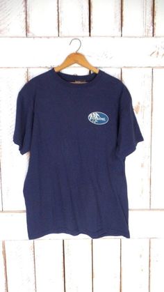 "90s dark blue graphic print t shirt/blue graphic print tee/Carnival/Fascination Measurements...taken flat -marked size: large -chest: 21\" (53.3 cm) -length: 28\" (71 cm) Condition... -excellent vintage condition -minimal wear TJJ854" Blue Crew Neck T-shirt With Front Print, Blue Graphic Print Crew Neck T-shirt, Navy Relaxed Fit T-shirt With Graphic Print, Blue Crew Neck T-shirt With Screen Print, Navy Crew Neck T-shirt With Screen Print, Blue Short Sleeve T-shirt With Graphic Print, Vintage Navy Cotton T-shirt, Blue Fan Merchandise T-shirt For Summer, Blue Crew Neck T-shirt For Fan Merchandise