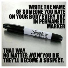 a pen sitting on top of a table next to an ad for sharpie ink