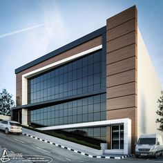 an office building with cars parked in front of it