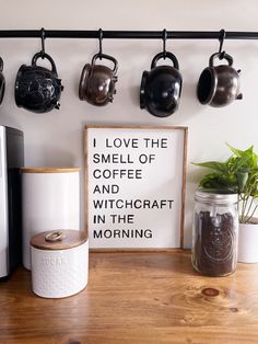 there is a sign that says i love the smell of coffee and witch in the morning