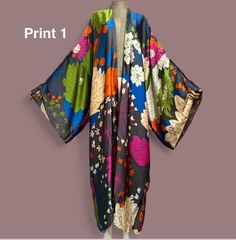 Our butterfly print kimono robe is designed to make you feel like you're on vacation every time you put it on. The beautiful colorful material provides comfort with a easy flow look for a beach cover up or vacation. This long robe is inspired to provides comfort and a fresh silhouette for a relaxed evening. It's elegant enough to wear as a bath robe yet stunning enough to wear over your favorite outfits.   Details: Size: ONESIZE Loose fitted Material: polyester  Hand wash, dry clean, tumble dry, Green Kimono With Kimono Sleeves, Green Free Size Kimono With Kimono Sleeves, Multicolor Printed Kimono For Beach Cover-up, Patterned Long Sleeve Kimono For Beach, Bohemian Long Kimono With Vibrant Print, Oversized Robe With Kimono Sleeves For Beach Cover-up, Long Sleeve Patterned Kimono For Beach, Long Patterned Kimono With Floral Print, Long Patterned Floral Print Kimono