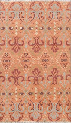 an orange and blue rug with ornate designs on the front, in various colors or shapes