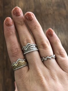 Our original white and yellow gold Teton stacking rings are iconic and customizable! Bring the mountains with you wherever you go. Featured here are our Teton stacks paired with diamond eternity bands. Re-pin if you love the mountains! Delicate Silver Rings, Diamond Eternity Bands, Morganite Diamond Ring, Gold Flower Earrings, Mountain Jewelry, Diamond Stacks, Sterling Silver Stacking Rings, Unique Bands