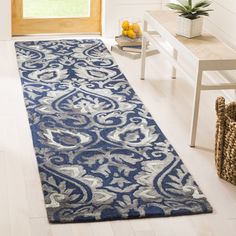 a blue and white rug in a living room