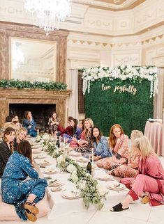 a group of women sitting around a table