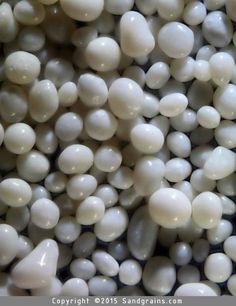 some white and black beads are piled together