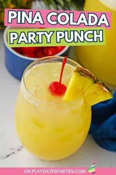 pina colada party punch in a glass with pineapple and cherries on the rim