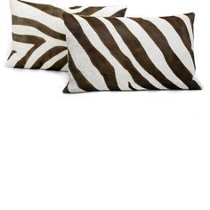 two brown and white zebra print pillows sitting on top of each other in front of a white background