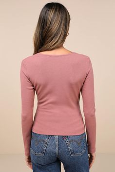 Everyone will love your sweet look in the Lulus Perfectly Cherished Mauve Knit Lace Long Sleeve Button-Front Top! Soft and stretchy ribbed knit shapes this chic little top that has long fitted sleeves, gathered cups, and a lace-trimmed V-neckline. Matching lace continues down the center of the slightly cropped bodice, alongside a line of decorative buttons. Fit: This garment fits true to size. Length: Size medium measures 20.5" from shoulder to hem. Bust: Great for any cup size. Waist: Fitted - Feminine Fine Knit Winter Tops, Feminine Long Sleeve Ribbed Tops, Knit Crew Neck Top With Button Closure, Feminine Crew Neck Tops For Fall, Fitted Knit Tops With Buttons, Feminine Fall Crew Neck Tops, Ribbed Pink Tops For Fall, Pink Ribbed Tops For Fall, Fitted Knit Top With Button Closure