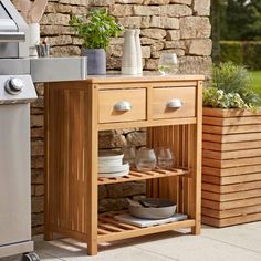 an outdoor kitchen with a grill and sink