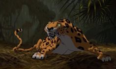 an animated image of a leopard laying down in the jungle with its mouth open and tongue out