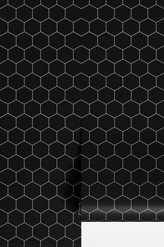 black and white hexagonal tiles with a blank paper