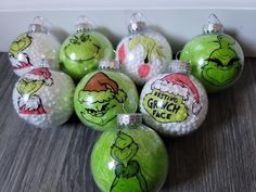 christmas ornaments with grin face designs on them