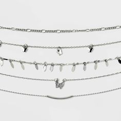 5-piece choker necklace set from Wild Fable™ makes a perfect pick for casual or dressier occasions. Varying designs range from simple linked chain to butterfly and bar charm. Made with silver-tone brass, the pieces close with lobster-claw clasps and come with extender chains for a customizable fit. If you're not satisfied with any Target Owned Brand item, return it within one year with a receipt for an exchange or a refund. Wild Fable™: A look for every story. Butterfly Choker Necklace, Butterfly Choker, Silver Choker Necklace, Choker Necklace Set, Silver Choker, Choker Necklaces, Clay Projects, Wild Fable, Lobster Claw