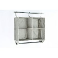 an over the door hanging storage unit with four pockets and two hooks on each side