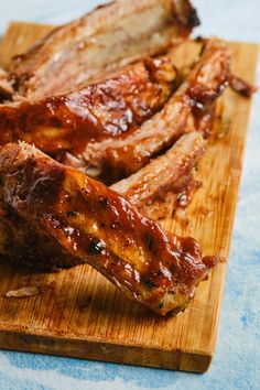 some meat is on a wooden cutting board