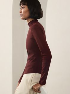 FOR: Commuting, work, and travel FEEL: Lightweight and luxurious rib texture FAVE: Ever-versatile wardrobe staple that matches everything Fitted next to the body Hem ends high on hip. Work And Travel, Versatile Wardrobe, Ribbed Turtleneck, Wardrobe Staples, Garnet, Turtle Neck, Texture, Wardrobe, Travel