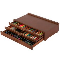 a wooden box with two drawers filled with colored pencils