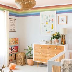 a baby's room with a crib and dresser