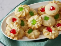 a plate full of cookies with gummy bears on them