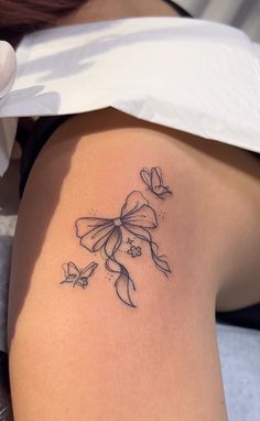 a woman with a tattoo on her thigh