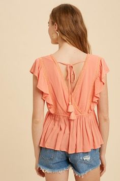 LACE INSET RUFFLED BUTTON TOP – Mota Boutique Bohemian Pink Top With Smocked Back, V-neck Rayon Top With Ruffles, Pink V-neck Top With Smocked Back, Feminine Orange V-neck Top, Orange V-neck Blouse With Ruffles, Bohemian Peach V-neck Tops, Coral Top, Lace Trim Top, Peplum Styling