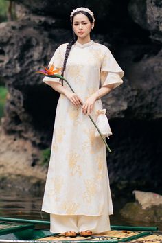 Elevate your wardrobe with our Ao Dai. Made from a luxurious blend of polycotton, this floor length Ao Dai features a flattering A-line silhouette and elegant mandarin neck. Take your style to the next level with this sophisticated and exclusive piece. Length: 124cm-125cm-126cm (S/M/L), Pants: 104cm-105cm-105cm (S/M/L) Ao Dai Plus Size, Pink Brocade, Mean Blvd, Dress Design Patterns, Design Patterns, Lace Design, Dress Design, Designer Collection, Yellow Blue