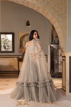 Step into the spotlight with this stunning Grey Georgette Net Embroidered Lehenga Set by Suruchi Parakh. Crafted from premium quality georgette and net fabrics, this set is perfect for any special occasion.
The gorgeous grey lehenga features intricate sequins embroidery that sparkles with every step you take, adding a touch of glamour to your look. The matching blouse perfectly complements the lehenga, and together they create a sophisticated and elegant outfit.
But the real showstopper is the c Fitted Net Choli With Cutdana, Fitted Net Pre-draped Saree For Reception, Fitted Net Sets For Wedding, Fitted Net Sharara With Cutdana, Fitted Net Lehenga For Reception, Intricately Embroidered Fitted Net Sets, Floor-length Organza Choli For Reception, Net Sets For Reception Diwali Festival, Intricate Embroidery Fitted Net Sets