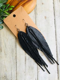 Black Crystal chain leather feather earring/boho leather dangle earring/long leather earring/feather chain earring Boho shabby chic! Black long feather, black crystal chain leather feather dangle earrings.Super light and ready to wear!  Gunmetal Hooks are lead and nickel free .Ready to sell will ship out same or next day in a gift box with tracking:) thanks for looking at my shop:) Diy Feather Earrings, Diy Leather Feather Earrings, Silhouette Jewelry, Leather Feather Earrings, Earring Long, Handmade Leather Jewelry, Chain Earring, Leather Earring, Handmade Jewelry Tutorials