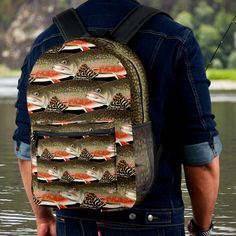 a man wearing a backpack with fish on it