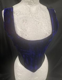 Rare find. This is a vintage purple / blue two toned lush velvet corset basque top by Raven clothing. Boned for shape.  It has black Lycra sides and a zip in the back. This is a size 12 Uk fits upto a 36 bust. Thank you for looking Fitted Gothic Purple Corset, Blue Fitted Corset For Costume Party, Gothic Velvet Corset With Boned Bodice, Gothic Underbust Velvet Corset, Fitted Purple Corset With Boned Bodice, Gothic Velvet Underbust Corset, Purple Fitted Underbust Corset, Fitted Blue Corset With Corset Back, Gothic Velvet Corset For Costume Party