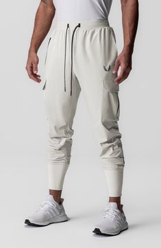 Built from extremely lightweight yet durable Tetra-Lite fabric, these joggers shed water and sport the comfort of four-way stretch. The high cuff ensures a secure fit that stays in place all day. 28 1/2" inseam; 7 1/2" leg opening; 12 1/2" front rise; 16 1/2" back rise (size Medium) Elastic/drawstring waist Front zip pocket; front slant pocket; cargo bellows flap-patch pockets; back zip phone pocket; shirt belt loop Four-way-stretch fabric Durable water-repellent (DWR) finish 76% nylon, 24% span Stretch Joggers For Streetwear, Functional White Joggers For Sports, Functional White Joggers For Jogging, Athleisure Joggers With Cargo Pockets For Outdoor, Sporty White Cargo Pants For Outdoor, White Athleisure Sweatpants For Training, White Joggers For Training, Functional White Jogging Pants, Functional White Pants For Jogging