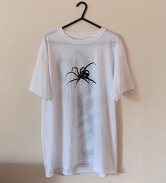 "Casual & comfy oversized tee with a unique hand drawn design  🕷️ The design has been drawn using fabric paint & will not fade or run when washed! Message me on insta for commissions @marikocustoms ❤️🔥 The top is a size large, seen on a size 8 - 10, 5\"5." Casual Hand Printed T-shirt For Streetwear, White Custom Print Grunge T-shirt, White Band Merch Top With Custom Artwork, Hand Painted White Short Sleeve Tops, White Hand Painted Short Sleeve Tops, White Hand Painted Short Sleeve T-shirt, White Crew Neck T-shirt With Hand Printed Details, White Hand-printed Crew Neck T-shirt, Hand Painted Cotton Graphic Tee