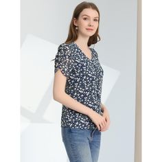 A casual t-shirt is essential to every well-edited wardrobe. Pair this stylish t-shirt with any bottoms to create casual outfits. It is also paired well with shorts or jeans for a chic look. Simple and delicate, this crop top features floral prints, buttons front, a V-neck, and ruched short sleeves. The combination of floral prints and a ruffle hem make this cute top such a beautiful piece. Trendy Summer Short Sleeve Top For Workwear, Trendy Short Sleeve Top For Summer Workwear, Elegant Short Sleeve Top With Floral Print, Trendy Short Sleeve Top For Work, Trendy Floral Print Top For Work, Elegant Short Sleeve Floral Print Top, Elegant Crew Neck Top With Floral Print, Elegant Floral Print Crew Neck Top, Blue Short Sleeve Tops With Ditsy Floral Print