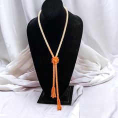 Stunning handmade Pacific pink coral beaded tassel, lariat style necklace with slide flower closure.  Measures - 15" Welcome to MyEZVintage! Thank you for stopping by! Enjoy looking and let us know if you need help with anything!  Pics are part of our description. Please view the ENTIRE listing carefully as we don't offer returns. If you have any questions, please ask us BEFORE purchasing. We're happy to answer you. We videotape all items being packaged and may affix a tamper-proof tag to cut before first wearing/using.  Located at MyStyle Boutique. Open Mon-Sat 10-5 at 11000 70th Ave. Seminole, FL 33772 Lariat Style Necklace, Artisan Jewelry Necklaces, Handcrafted Artisan Jewelry, Pink Coral, Coral Beads, Beaded Tassels, Style Necklace, Hand Beading, Artisan Jewelry