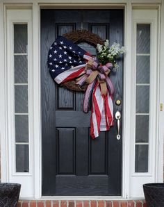 an american flag wreath on the front door