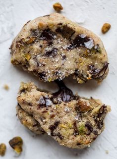 two chocolate chip cookies sitting on top of each other