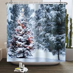 a shower curtain with a christmas tree in the snow