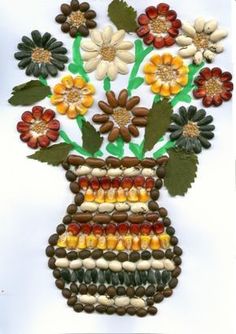 a flower vase made out of beads and stones