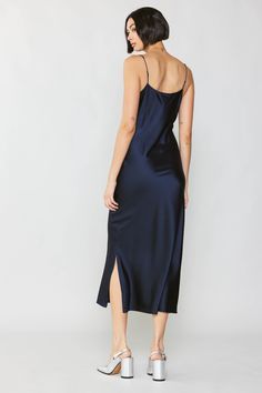 This luxe, mid-length slip dress has that alluring '90s minimalist look down pat. From that sexy little slit to the way it glides along the contours of the body, it's designed to make you feel like the goddess you are. •Adjustable shoulder straps •Bias cut •Side slit •Midi length DIMENSIONS •Standard: 46 Length Item number: 2090363 100% Silk Navy Midi Dress, The Goddess, Cami Dress, Item Number, Mid Length, Make You Feel, Midi Length, Shoulder Straps, Feel Like