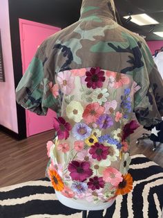 Biggest Trend of the season with the floral detailing on the back, makes them look as you walk away , loose style. Easy to pair with jeans or leggings. The flowers are like A 3D illusion popping off the jacket like a real garden effect. Vintage Camo , netted sheer back with floral detail . Trendy Spring Outerwear With Short Sleeves, Trendy Short Sleeve Spring Outerwear, Trendy Short Sleeve Outerwear For Spring, Trendy Short Sleeve Summer Outerwear, Bohemian Short Sleeve Spring Outerwear, Trendy Floral Embroidered Summer Outerwear, Bohemian Short Sleeve Outerwear For Fall, Multicolor Floral Embroidered Spring Outerwear, Spring Multicolor Floral Embroidered Outerwear