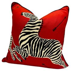 a red pillow with a zebra on it