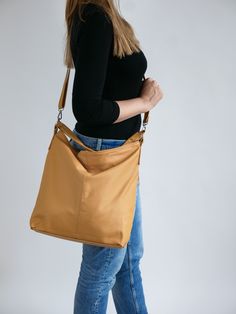 The leather handbag is made of 100% high quality natural Italian leather. Leather handbag in fashionable style and classical style. The interior of the bag has lining. The shopper purse is very roomy, fits easily A4 format (US Lettel format) Large pocket inside of the bag divides the compartment into two parts Closed with a zipper / slider It has as a long adjustable strap allowing you to wear is on the shoulder or crossbody. Inside there are two pockets: one zipped, one for a phone and an addit Natural Leather Bag, Slouchy Tote, Everyday Tote Bag, Brown Tote Bag, Large Leather Tote Bag, Classical Style, Everyday Tote, Leather Bag Women, Leather Hobo Bag