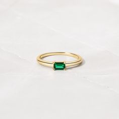 Beautifully crafted emerald ring is a true stunner! Looks great stacked or on its own! - - - D E T A I L S - - - * Made of 925 Sterling Silver * We use a THICK plating of 14k Gold or Rhodium * Available in sizes 4-10 * 3x5mm Baguette Stone * Nickel-free & Hypoallergenic - Will not turn your fingers green! * Made of the highest grade cubic zirconia for an authentic look! * Also available in White Cubic Zirconia https://www.etsy.com/listing/1327774787/baguette-ring-dainty-stacking-ring?click_key=1 Classic Green Emerald Stackable Rings, Stackable Emerald Cut Emerald Birthstone Ring, Classic Green Emerald Cut Stackable Rings, Green Emerald-cut Stackable Rings, Classic Green Emerald-cut Stackable Rings, Green Emerald Cut Stackable Birthstone Ring, Green Emerald-cut Stackable Birthstone Ring, Stackable Emerald Cut Green Birthstone Ring, Classic Green Rings For Everyday Wear