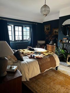 a bed room with a neatly made bed next to a window and a rug on the floor