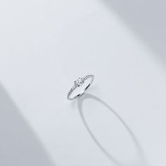 The center rose cut diamond that sits between two tapered baguettes evokes an art-deco vibe. The low profile nature of the rose cut allowed us to make an engagement ring where the diamonds all flowed into each other while hugging the finger for ultimate wearability. 14K sustainable gold Center: 0.25ct natural rose cut diamond 0.22 tcw of tapered baguette and round natural diamonds All diamonds are GH color/VS clarity Dimensions: Band Width 2.0mm taperingDelivery: This item is made to order. Plea Dainty Round Cut Diamond Ring For Proposal, Dainty Round Cut Diamond Proposal Ring, Fine Jewelry For Proposal With Rose Cut Diamonds, Fine Jewelry Diamond Ring For Proposal With Baguette Cut, Elegant Solitaire Diamond Ring For Proposal, Timeless Lab-grown Diamond Ring With Rose Cut Diamonds, Delicate Solitaire Diamond Ring For Proposal, Fine Jewelry Diamond Ring With Baguette Cut For Promise, Fine Jewelry Baguette Cut Diamond Promise Ring