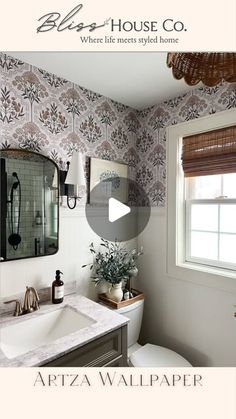 a bathroom with a sink, mirror and toilet in it's center piece is shown